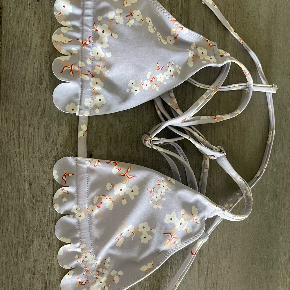 Purple floral bathing suit top with scallop designs